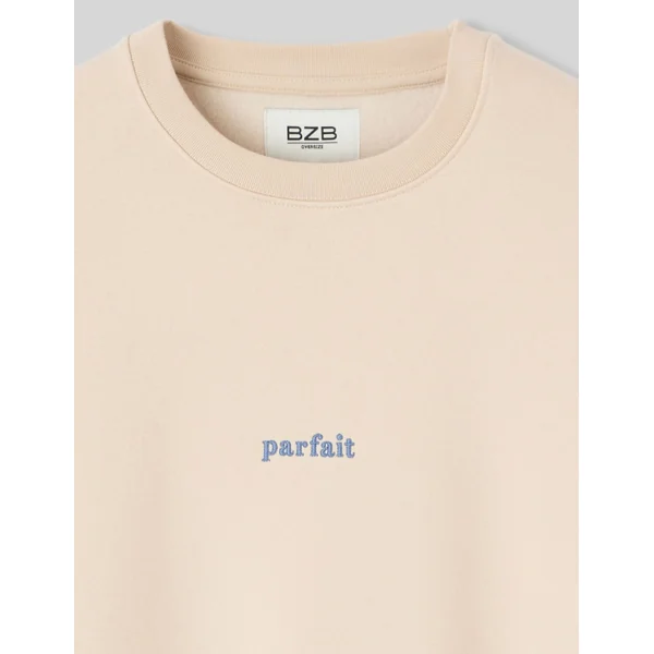 Sweat col rond broderie poitrine Blanc cassé
