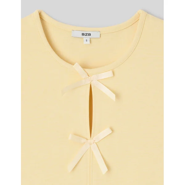 Top sans manches à nœuds JAUNE PASTEL